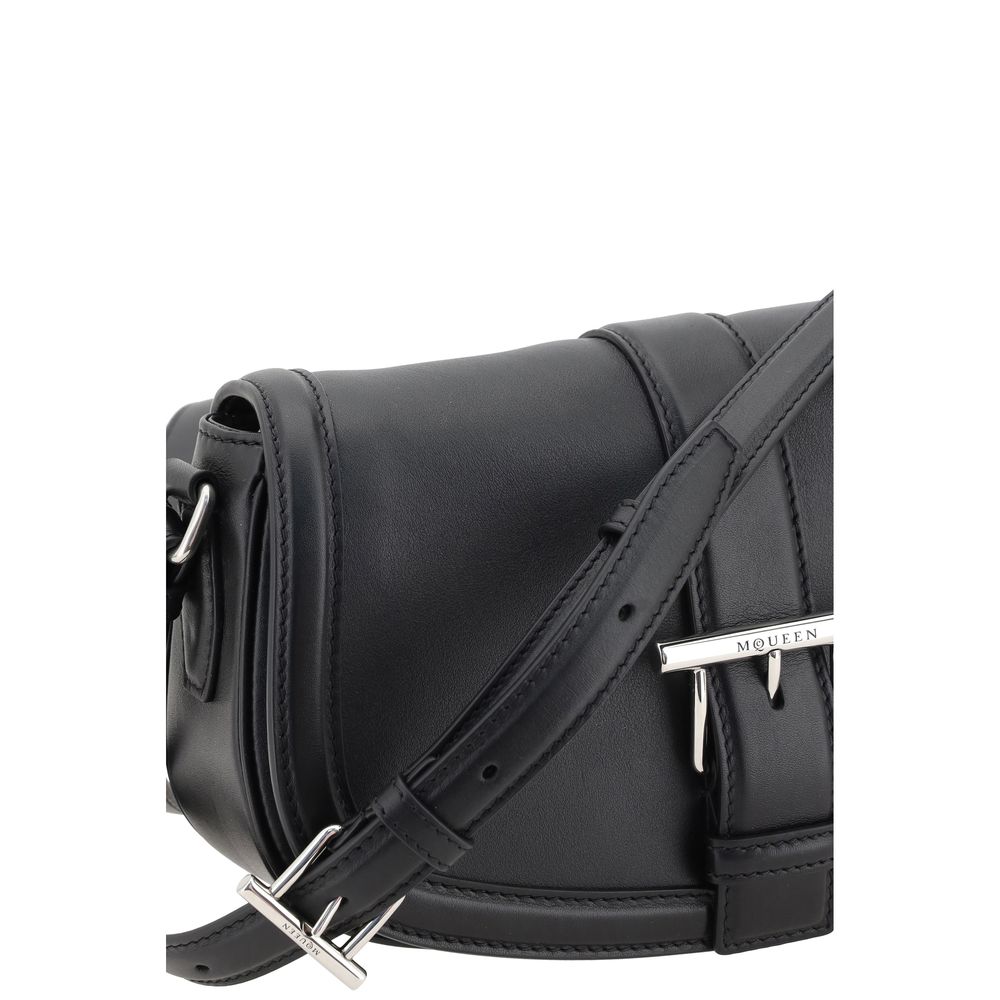 Alexander McQueen T-bar Satchel Bag - Black shoulder bag with silver buckle on a white background
