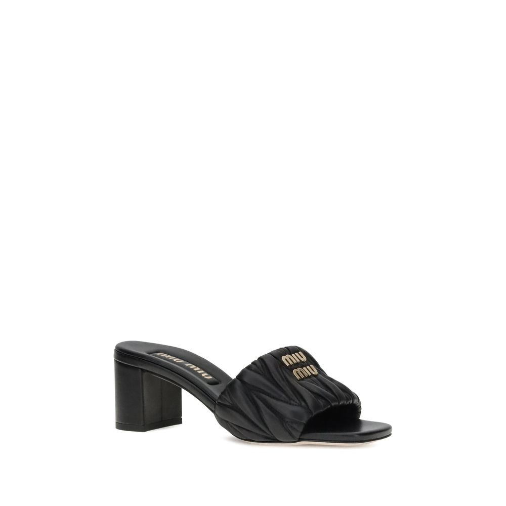 Miu Miu Logoed Sandals - Black sandal with a block heel on a white background