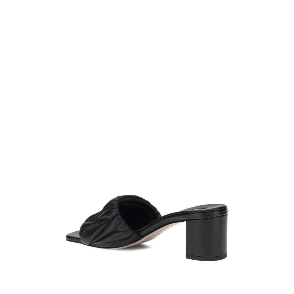 Miu Miu Logoed Sandals - Black sandal with a block heel on a white background