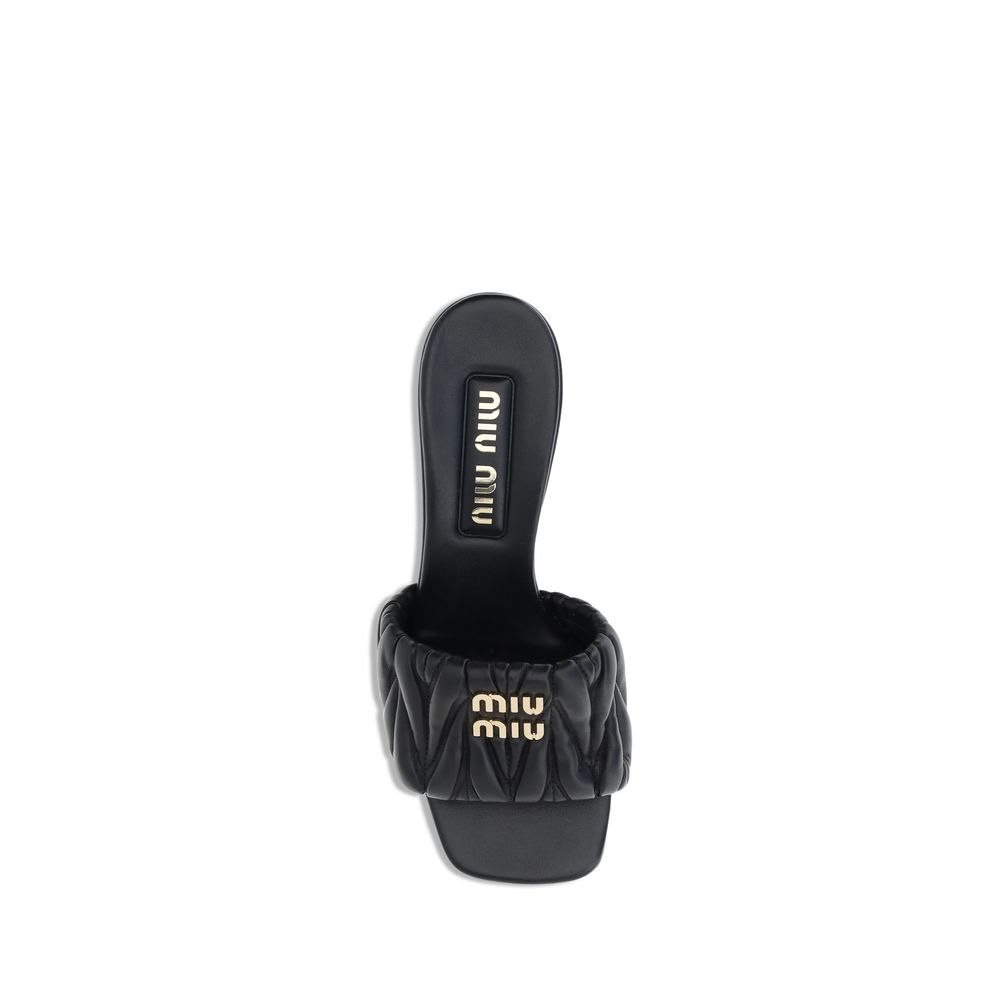 Miu Miu Logoed Sandals - Black sandal with a block heel on a white background