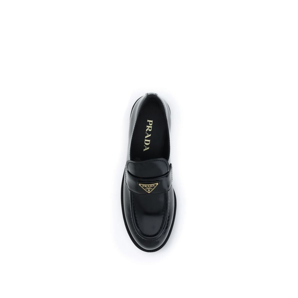 Prada
Black Calf Leather Bos Taurus Slip-On Loafers - Black leather loafer on a white background