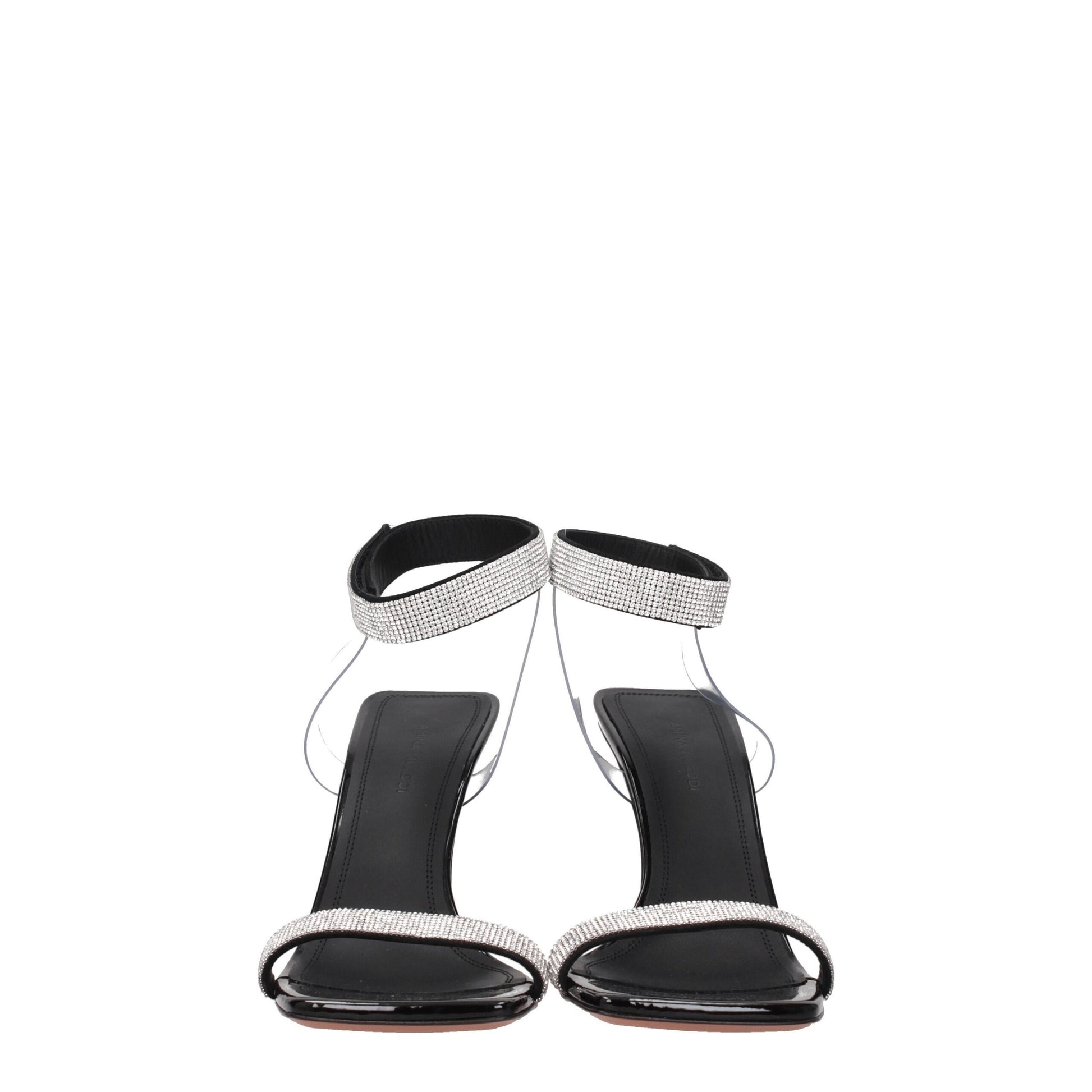 Black high-heeled sandals with rhinestone straps on a white background