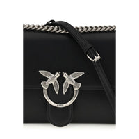 Black handbag with silver bird embellishments and a chain strap on a white background